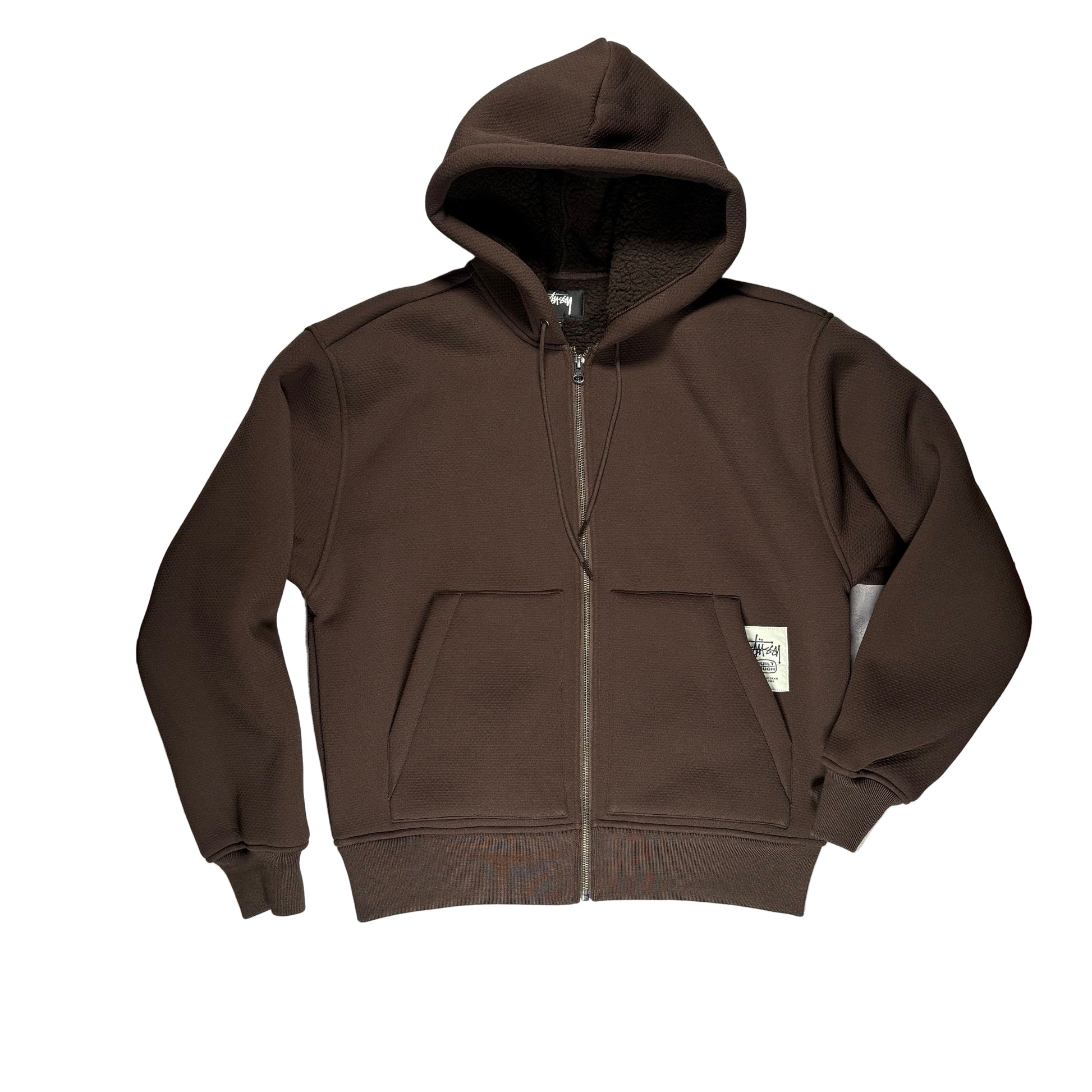 Brown zip hoodie on a whitesurface with wooden borders