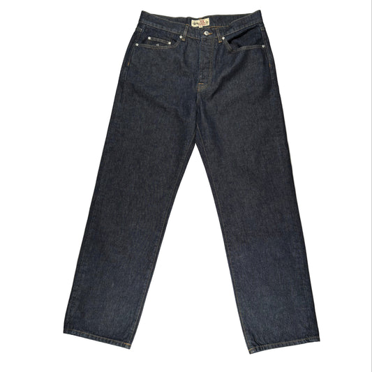 Pair of dark blue jeans on a white surface
