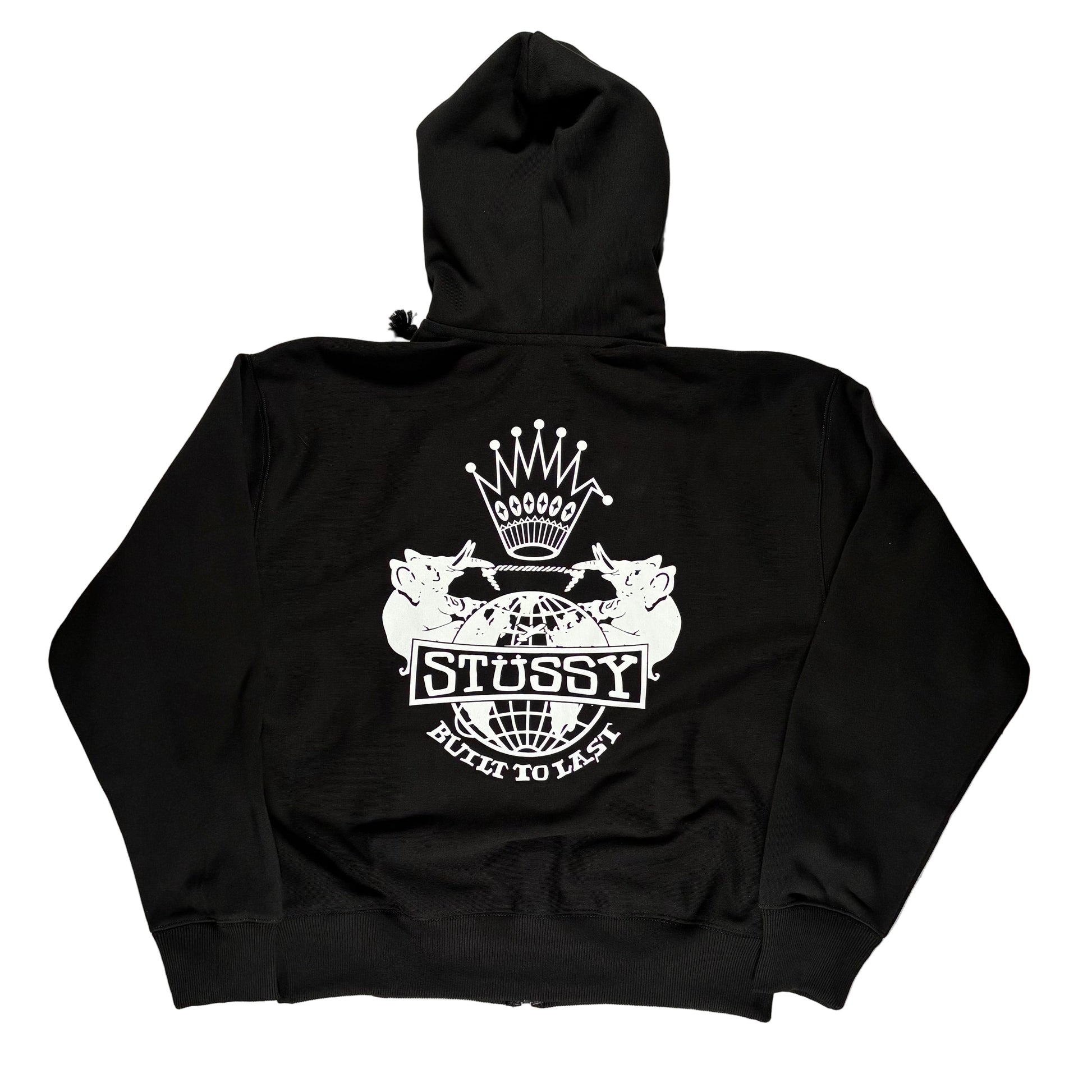 Black hoodie with Stussy logo on a gray surface