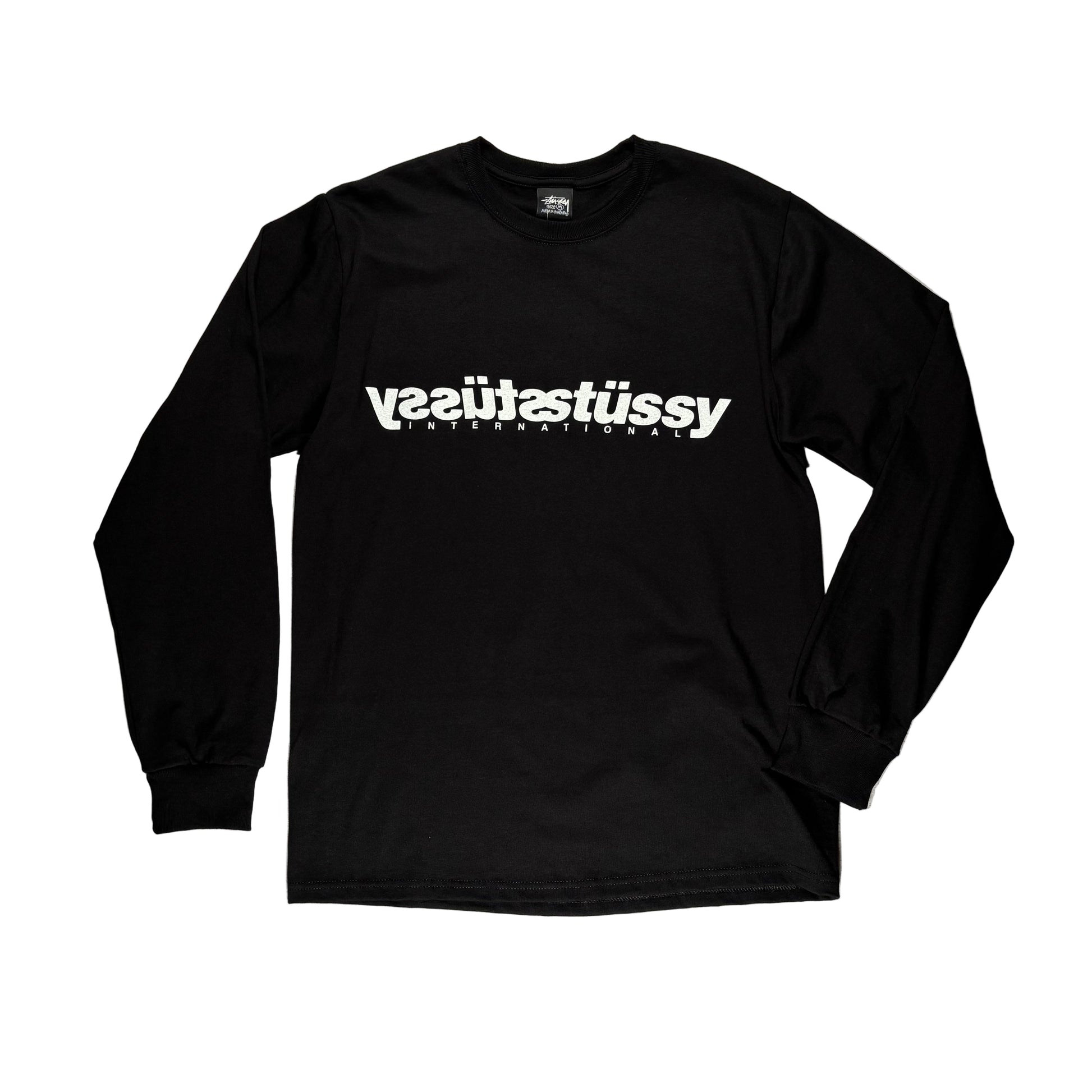 Black long-sleeve shirt with white STUSSY text on a white surface