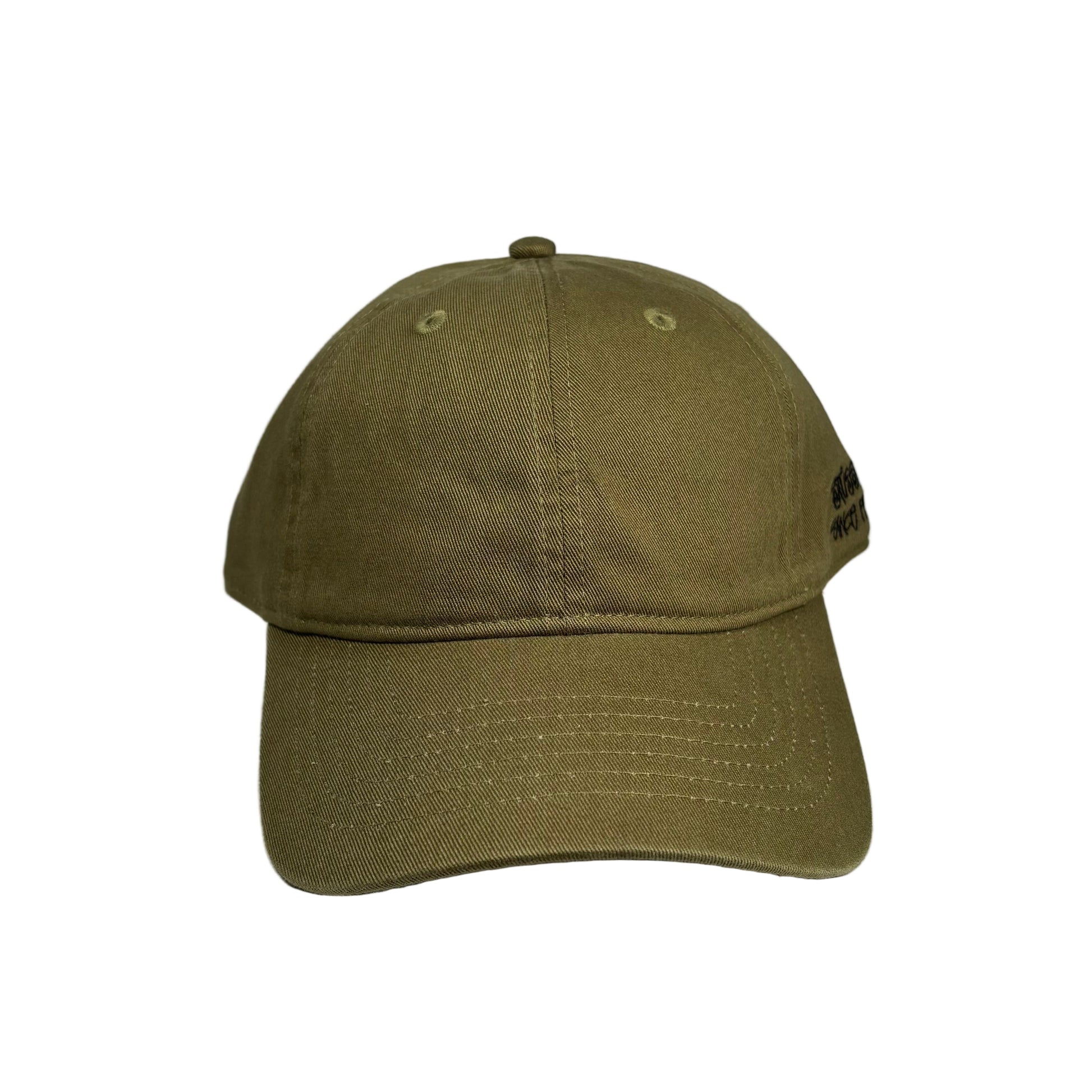 Green baseball cap on a white surface  background