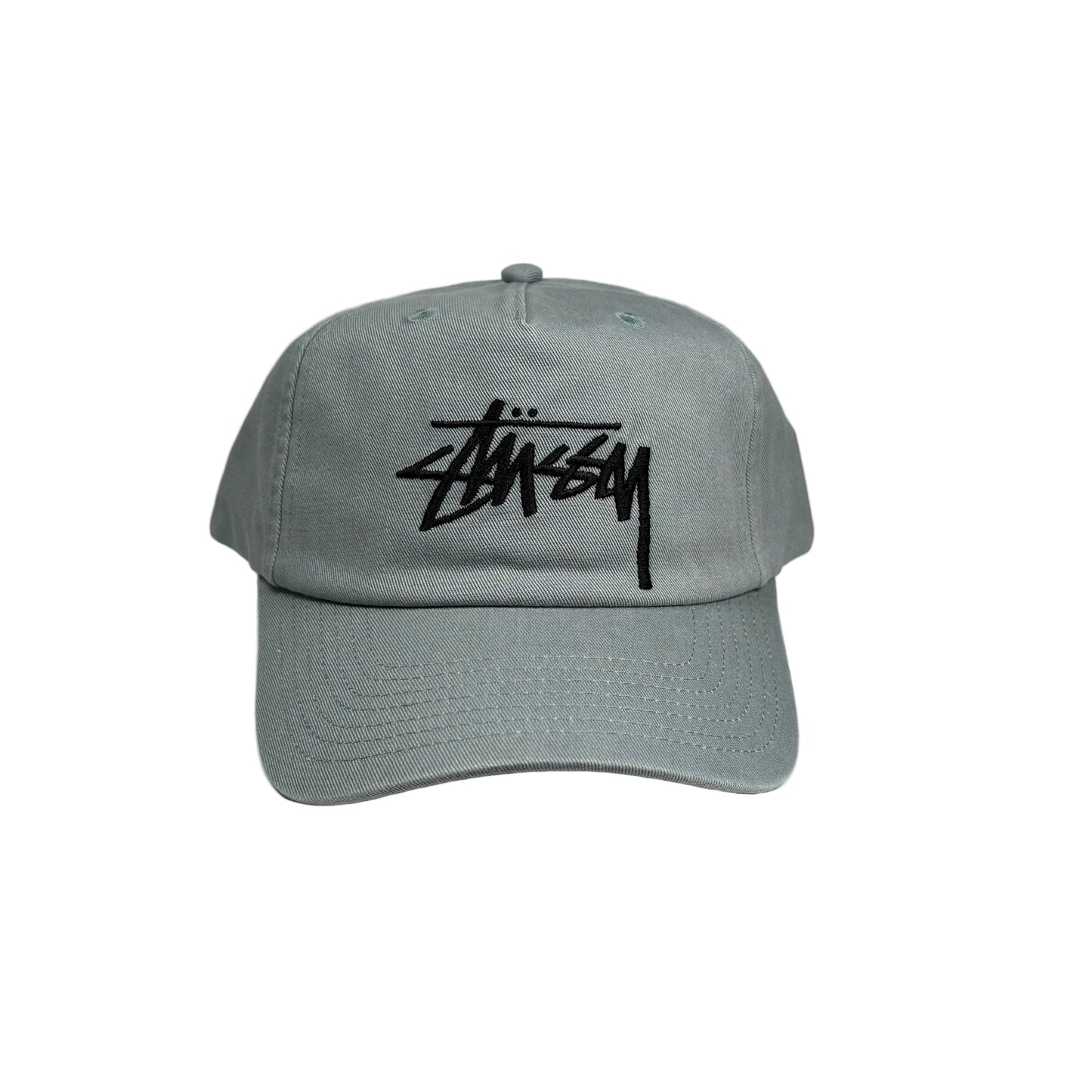 sea green cap with black stussy logo on a white background