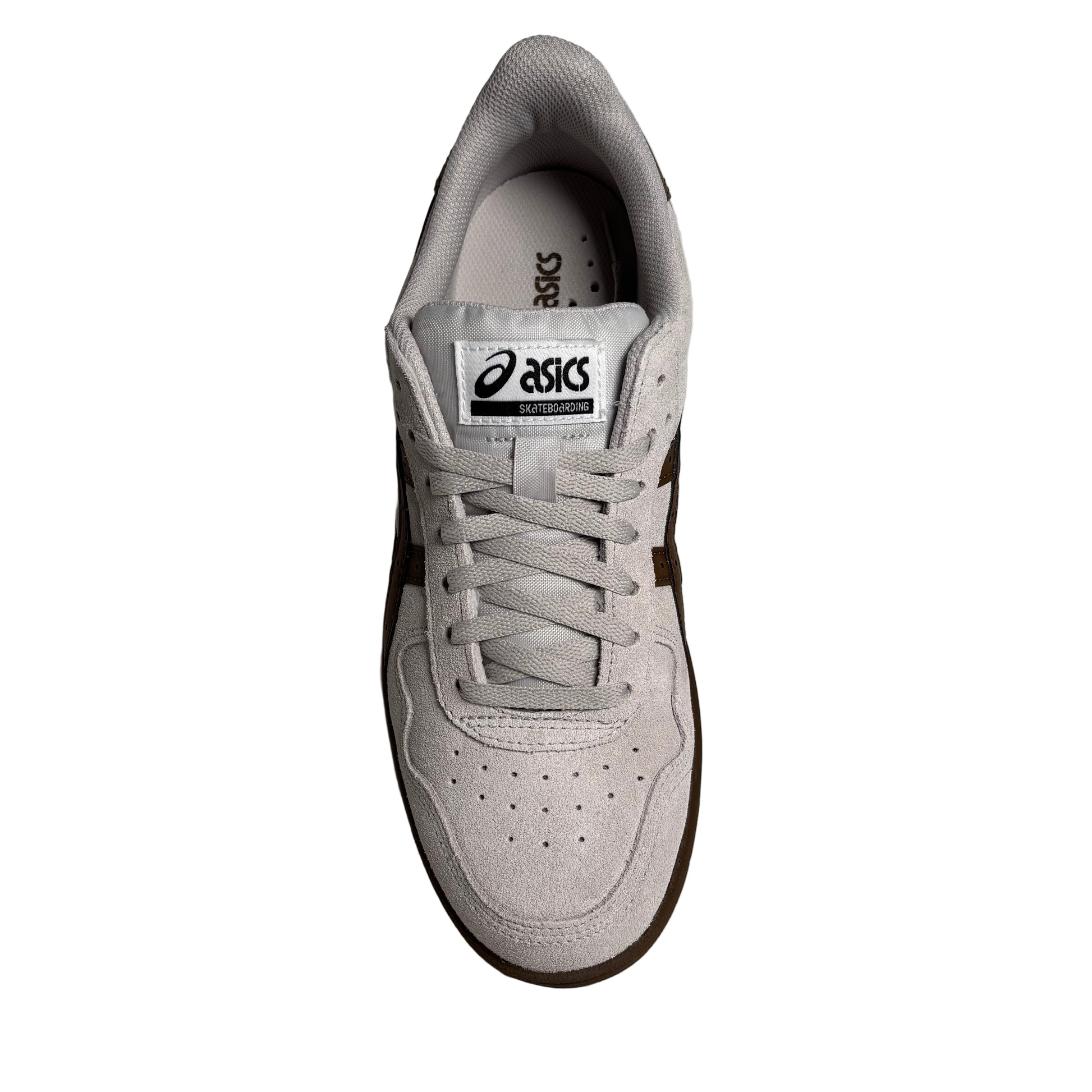 top down view Gray sneaker with brown accents on a white surface