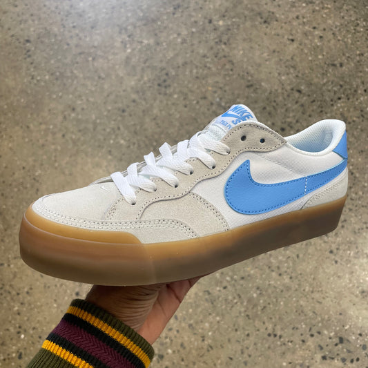 white and light blue sneaker with gum sole
