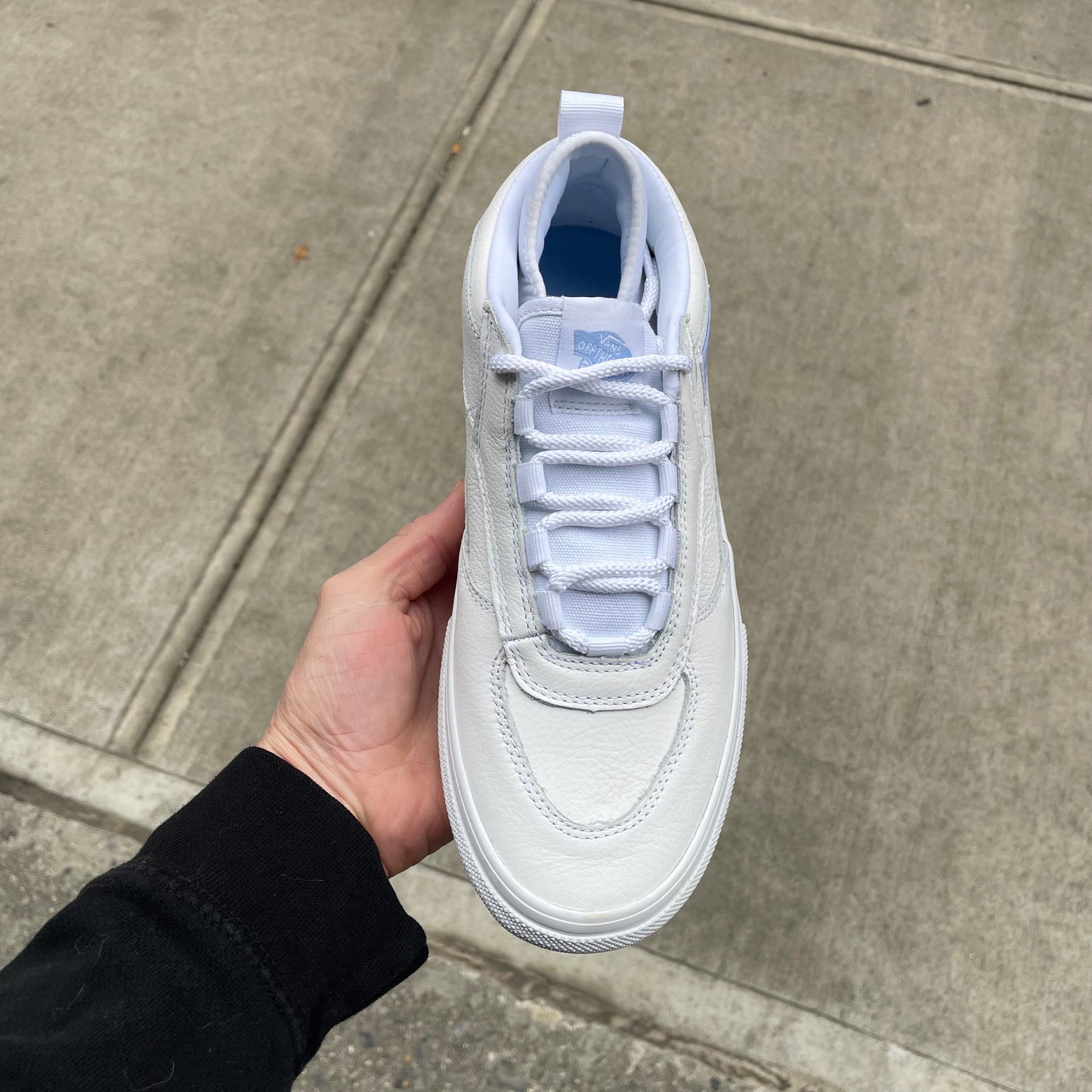 top down view of leather low top shoe, laces, and toe box