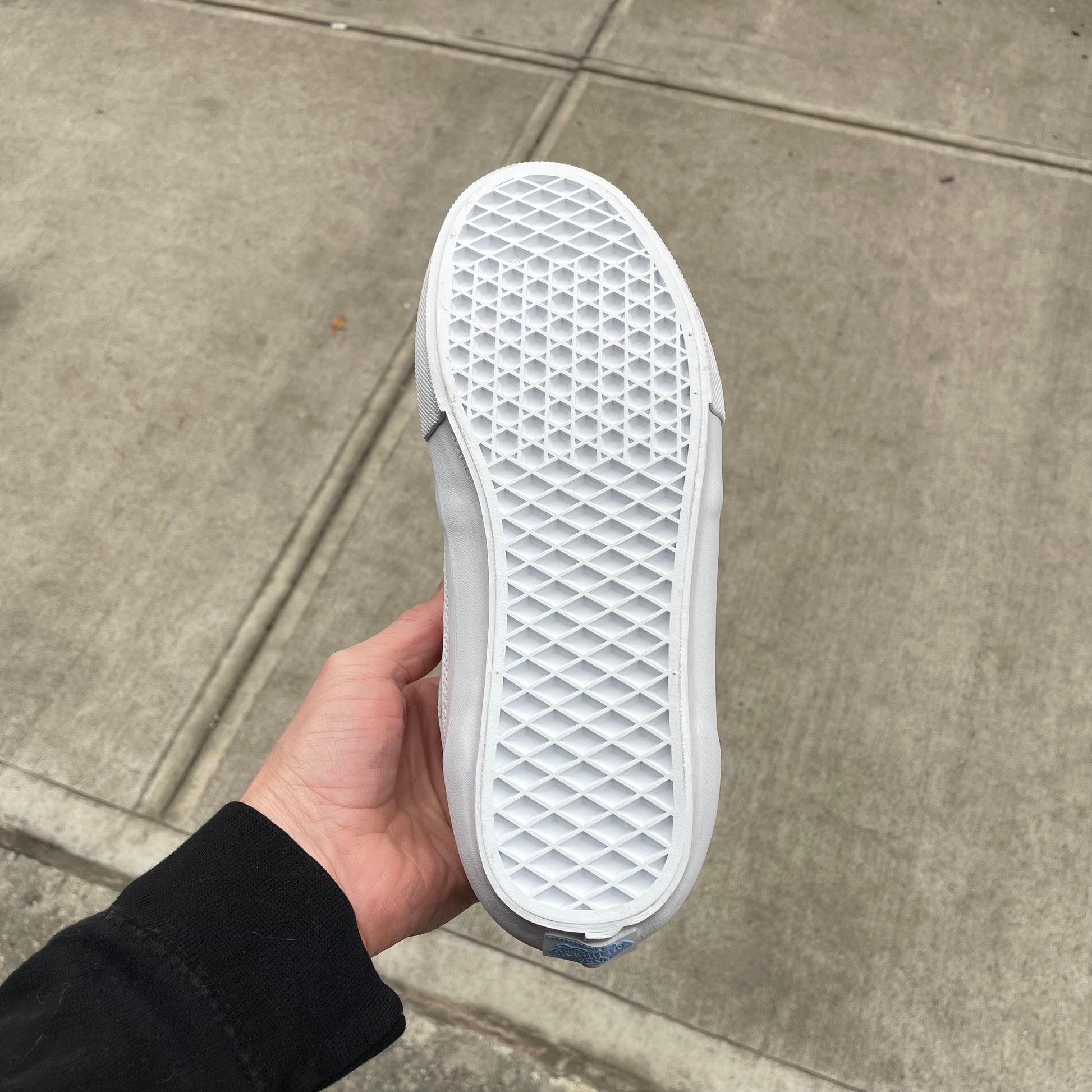 view of sole on all white tonal skate shoe