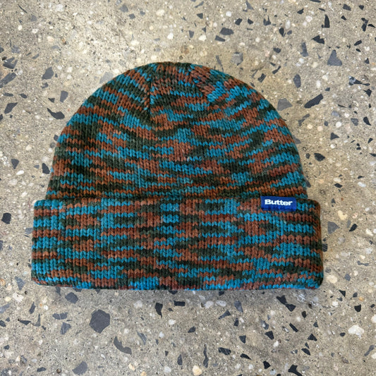 blue, black, and brown multicolor beanie