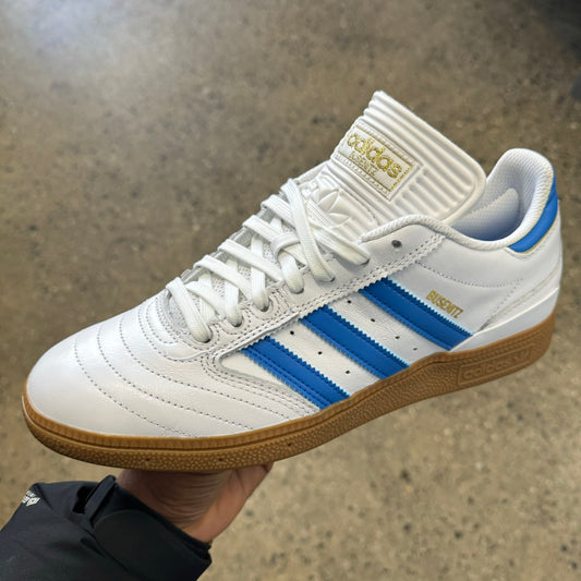 white leather sneaker with gum sole and blue stripes
