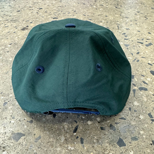 back view of green and navy hat