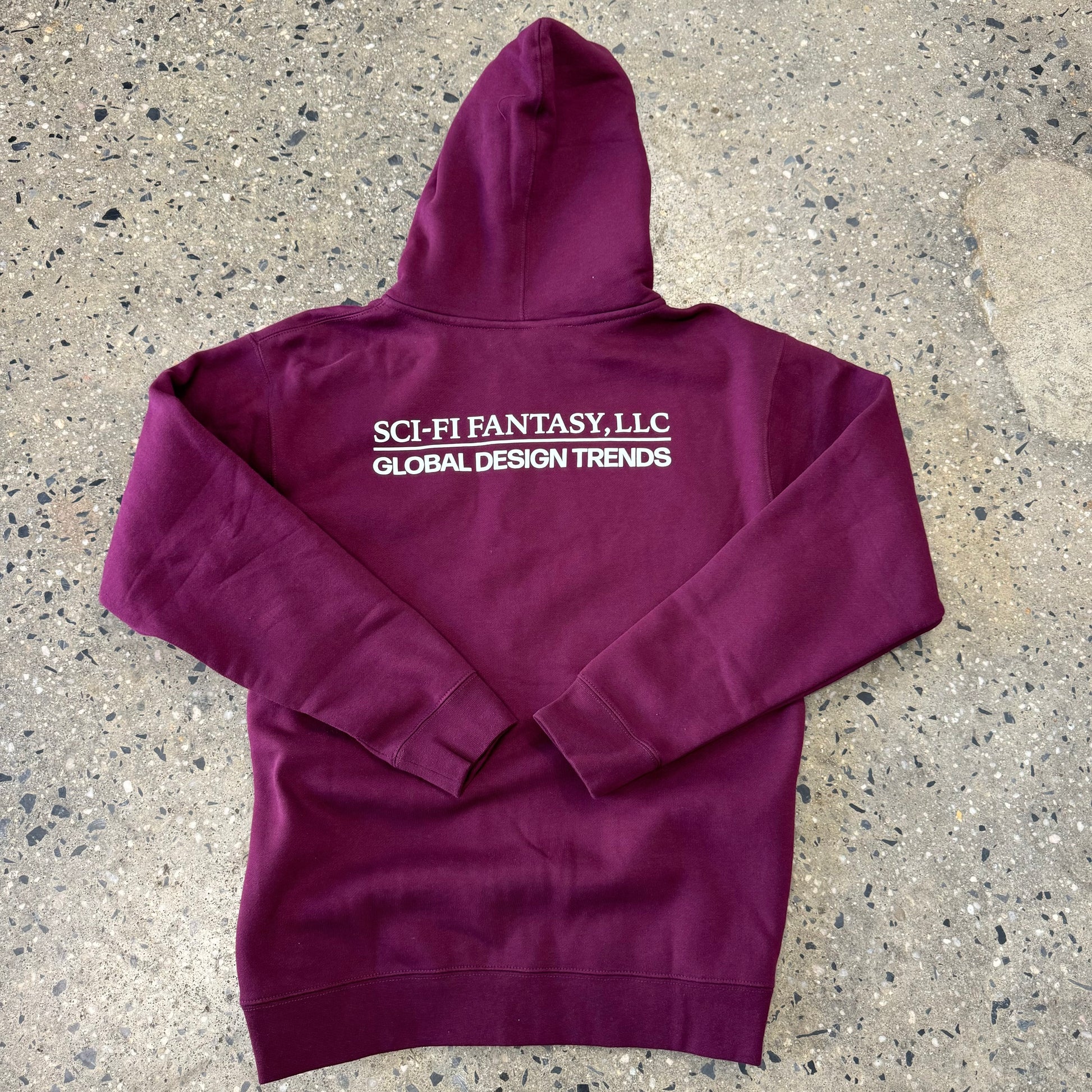 back view of maroon hoodie with white logo across shoulders