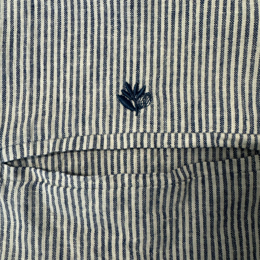 closeup of navy leaf logo above pocket