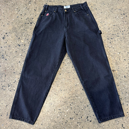 black denim pants with dollar sign embroidered logo on viewers left coin pocket