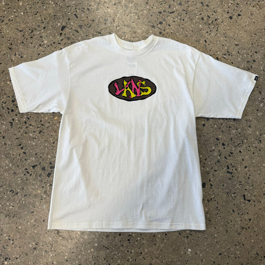 pink, yellow and brown oval logo printed on center of white t-shirt