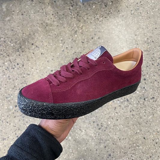 wine suede sneaker with black sole, side view