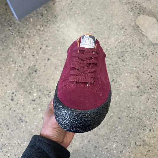 wine suede sneaker with black sole, front view