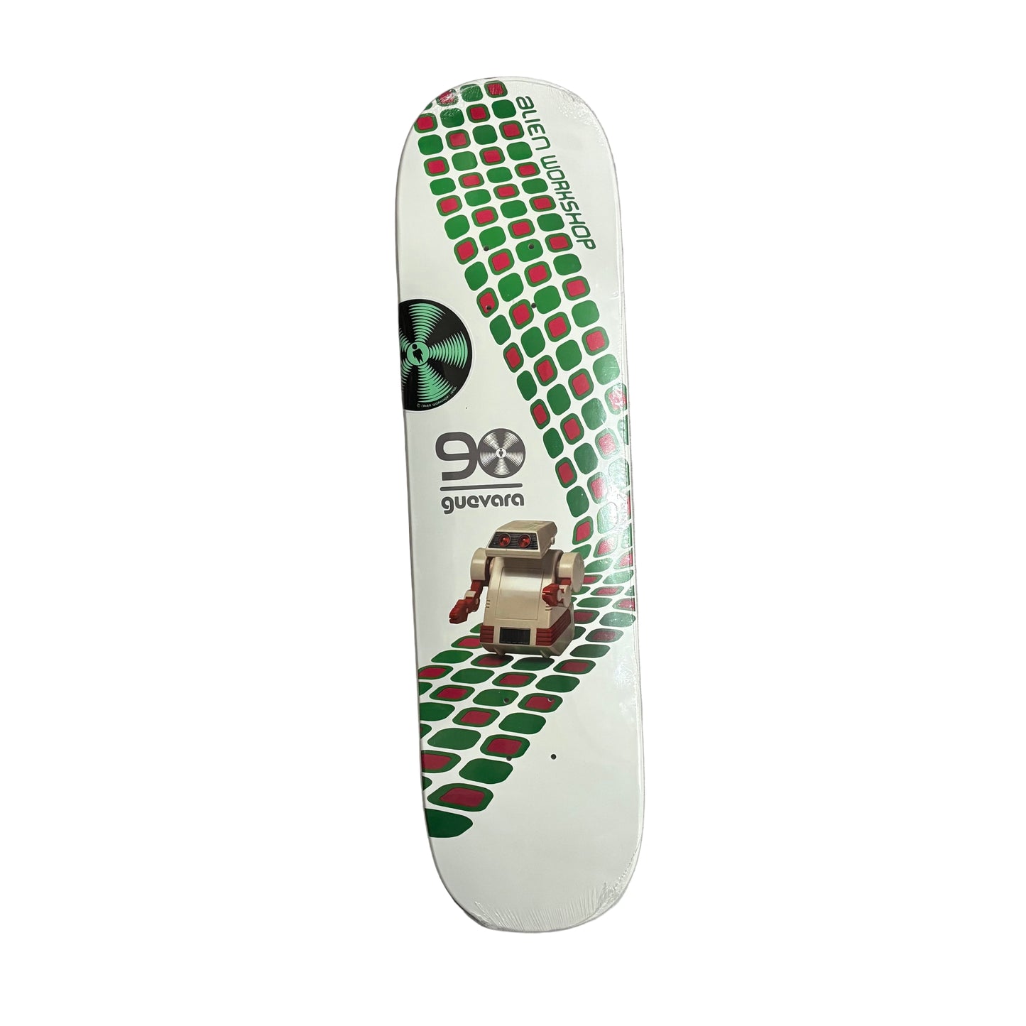 Skateboard deck with green and red pattern on a white surface