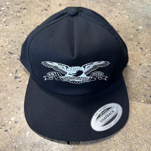 front view  of White spread wing eagle logo on black snapback hat