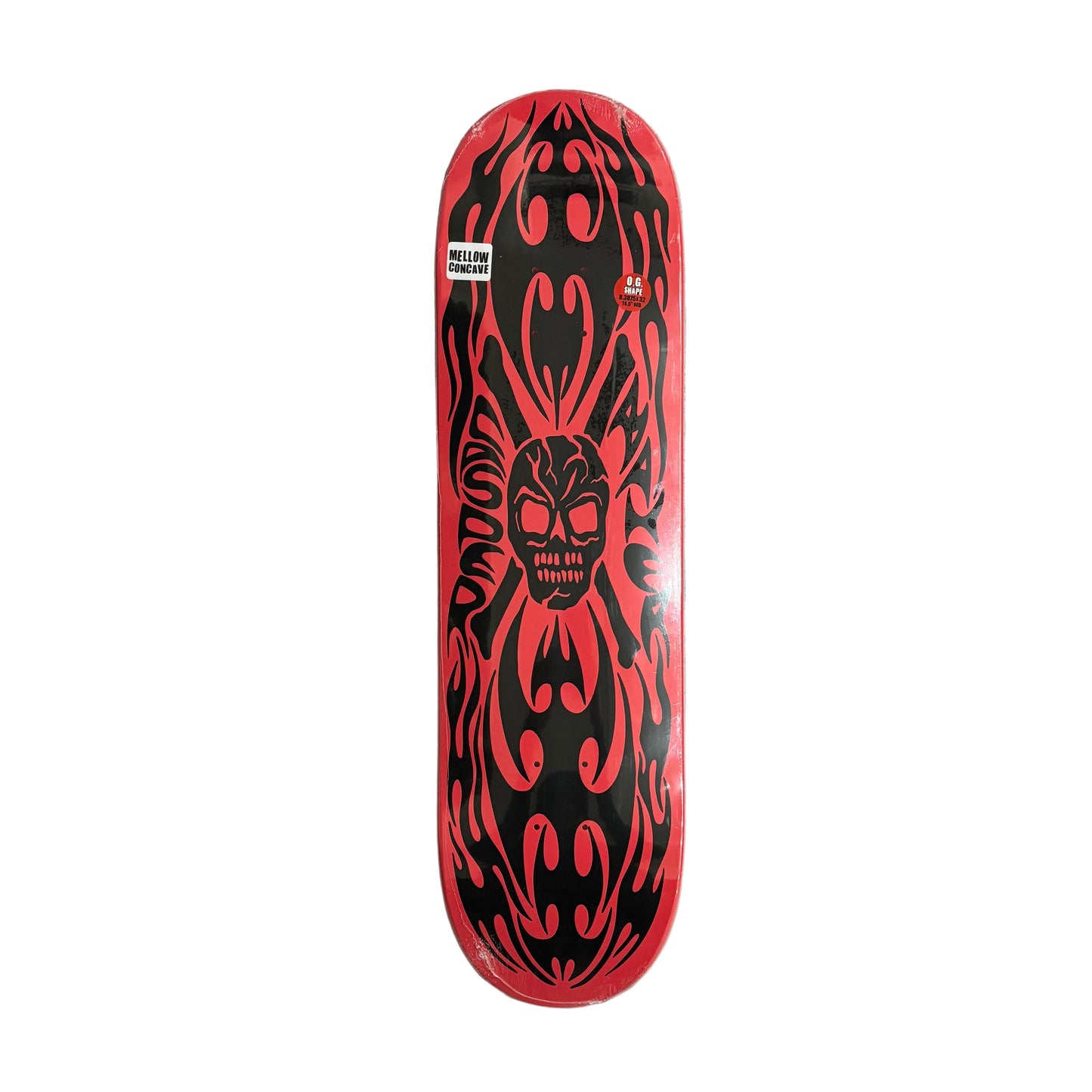 Skateboard deck with red and black tribal design on a white surface