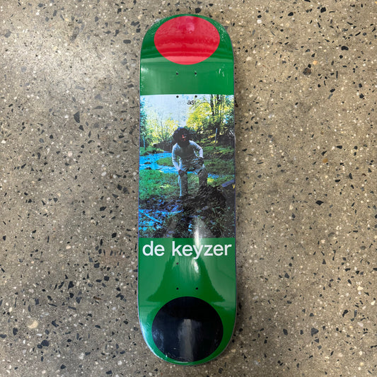 guy in nature on green skate deck