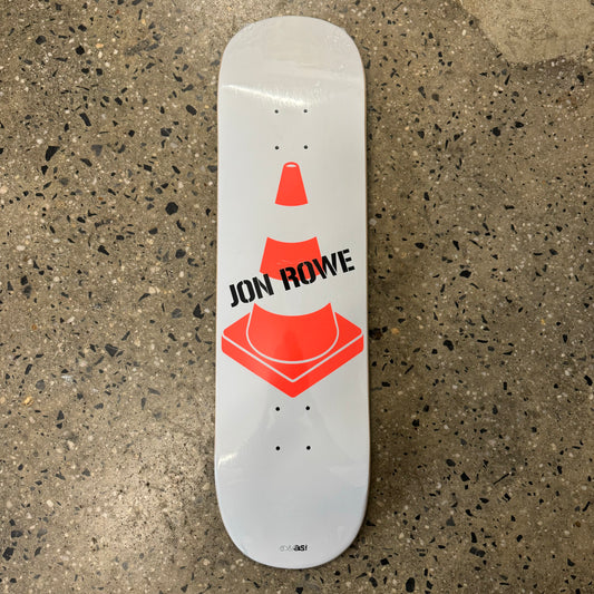 orange traffic cone on white skate deck