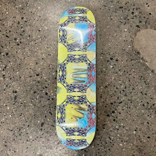 yellow, blue, red, black abstract design on skate deck