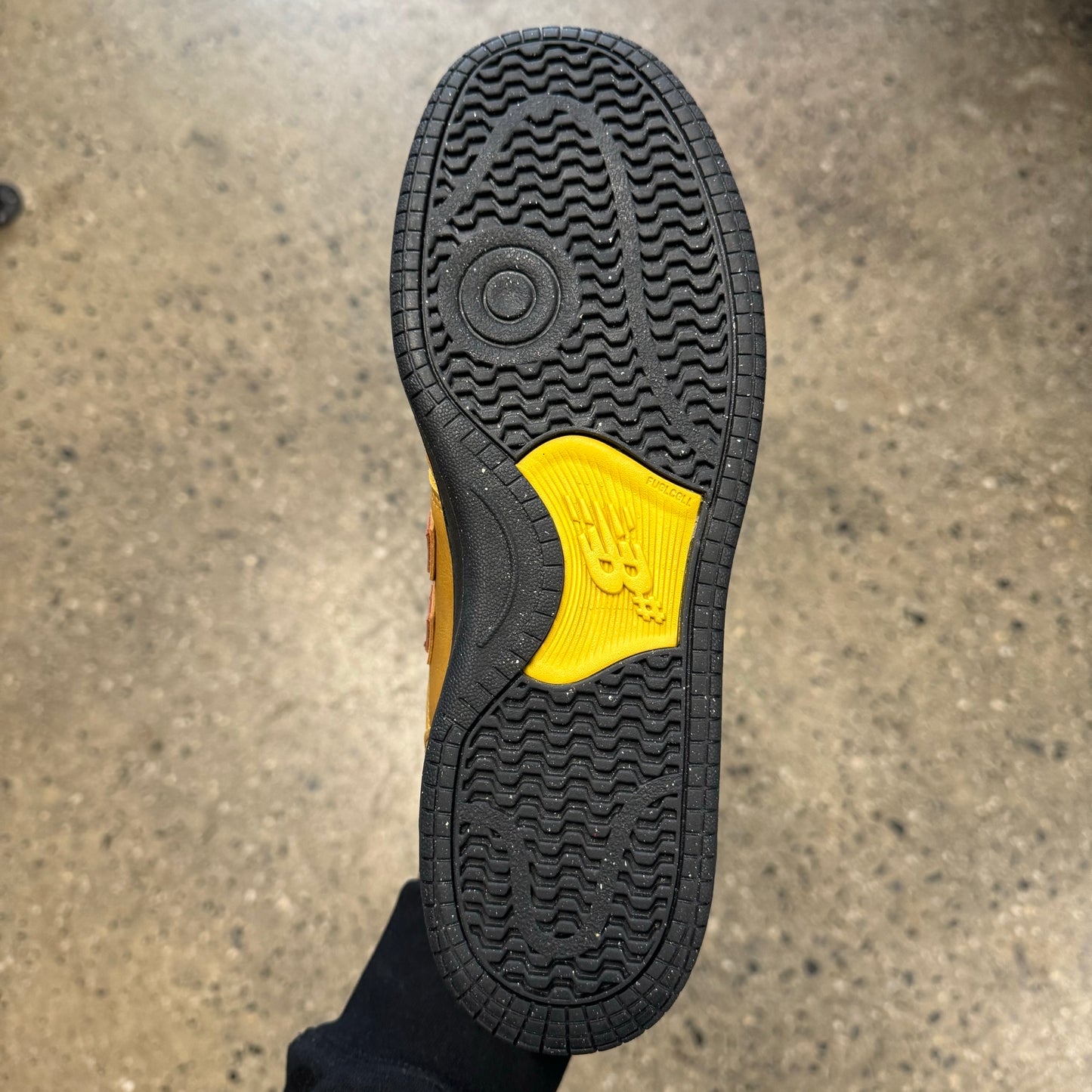 black and yellow sole, bottom of sneaker