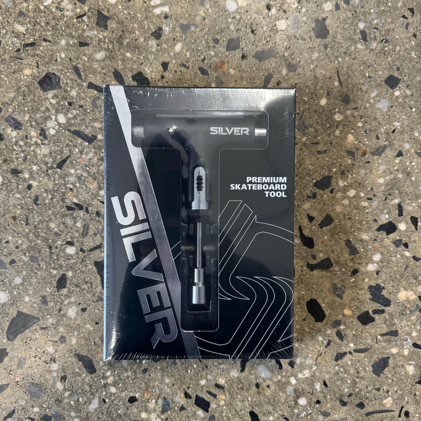 black and silver skateboard tool