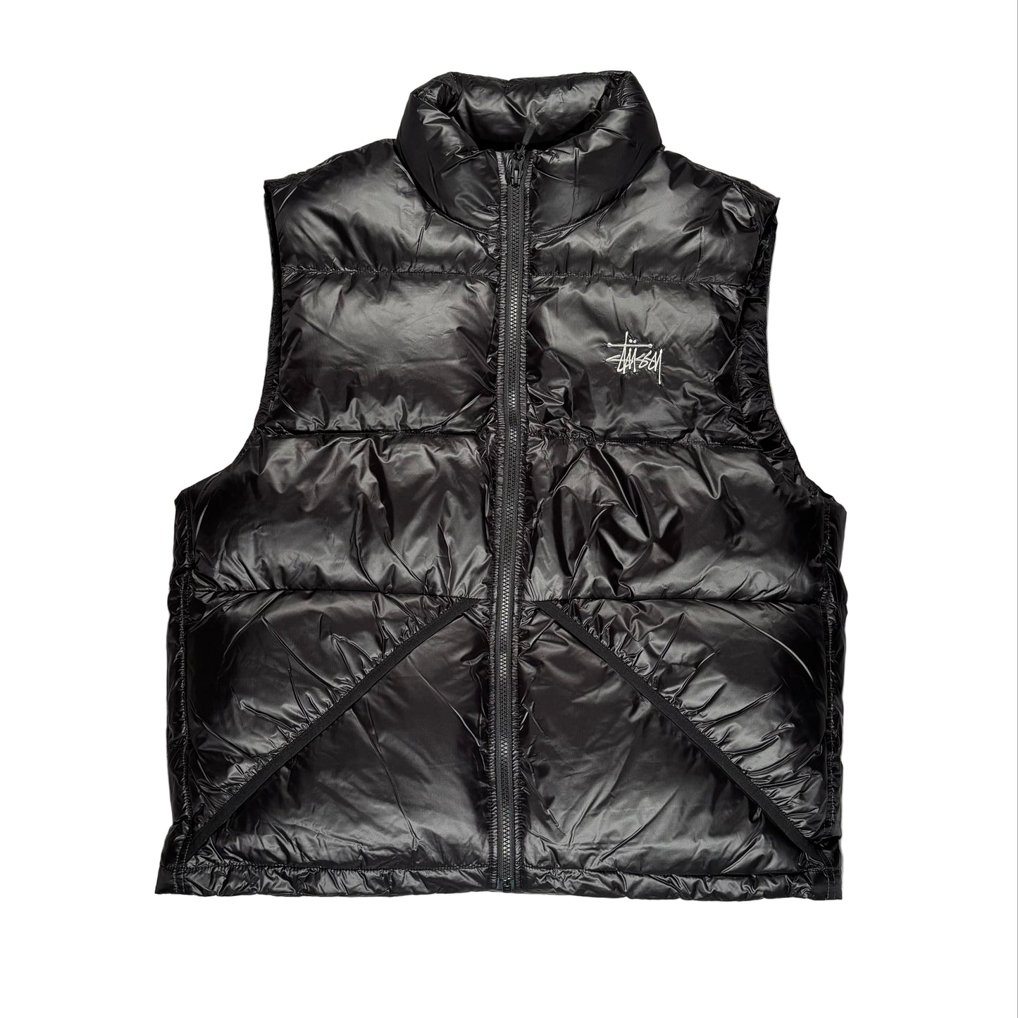 Black puffer vest with a brand logo on a white surface