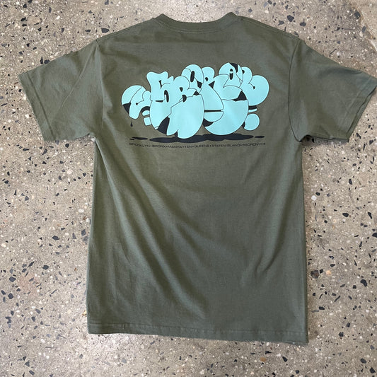Large back print of 5boro graf style logo in mint green, on olive t-shirt. Name of all five boroughs of New york city underneath logo