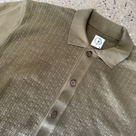 closeup of collar and brown buttons