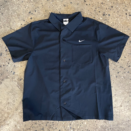 black short sleeve button down shirt with white logo
