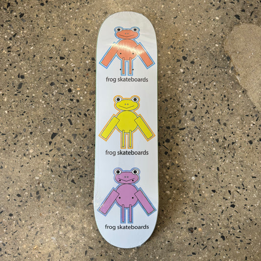 child like drawing of an orange, a yellow, and a purple frog on a white skate deck