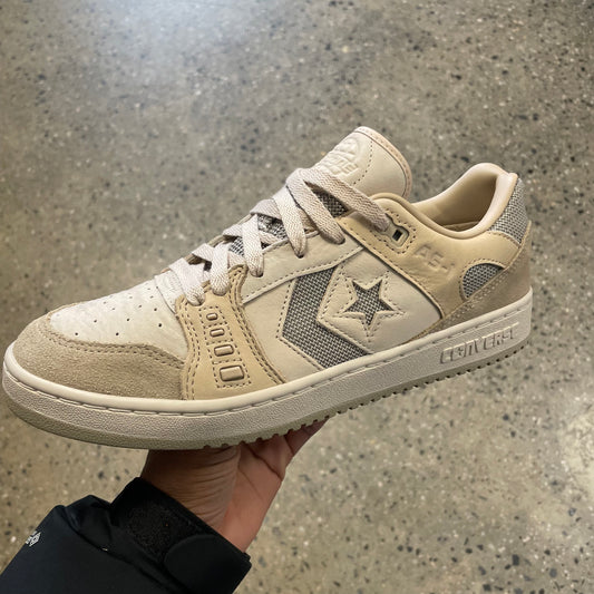 tan leather and suede sneaker with grey canvas stripe and star