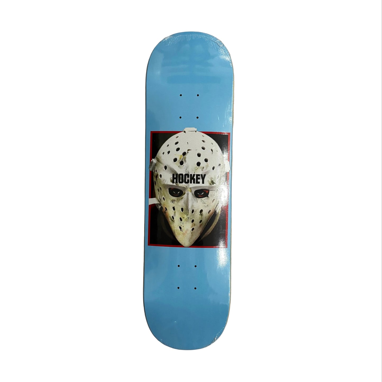 Skateboard deck with hockey mask design on a white surface