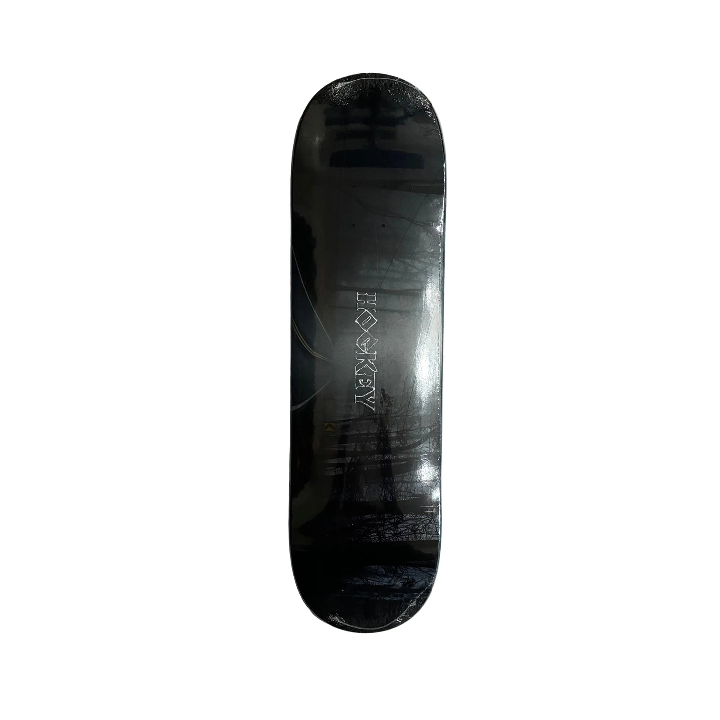 Black skateboard deck with a brand logo on a white surface