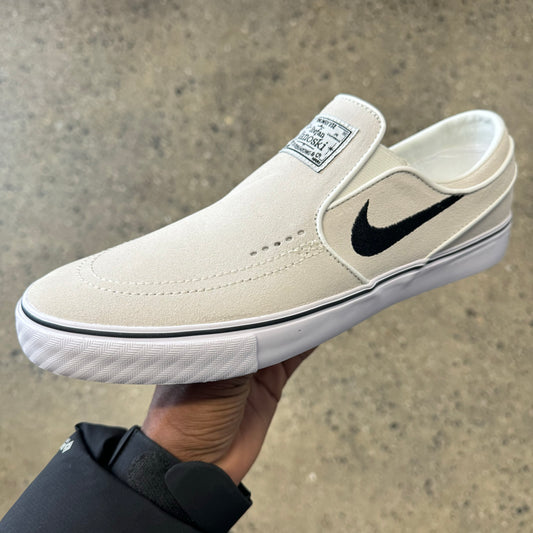 white and black suede slip on sneaker with white sole