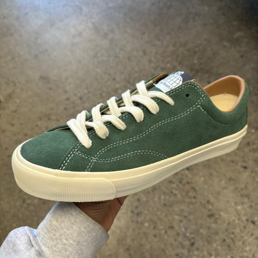 green suede sneaker with white sole and stitch