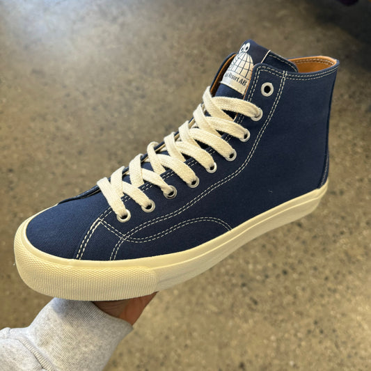blue hi top sneaker with white sole and white stitch