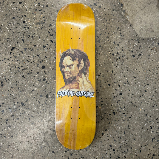 monster head on yellow skate deck