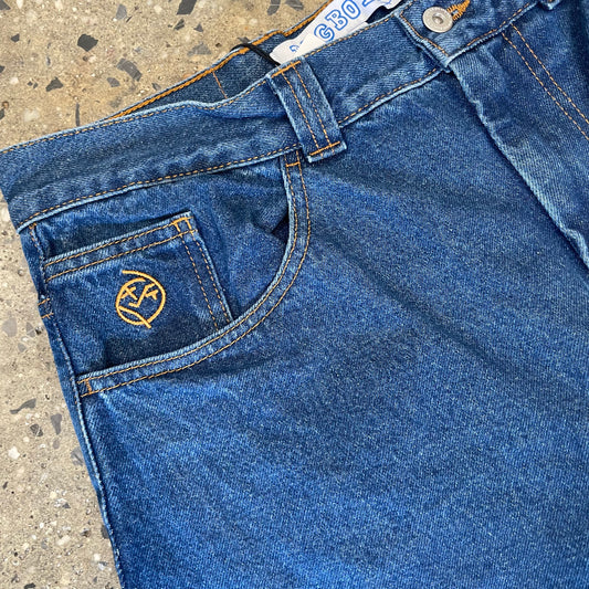 closeup of front pocket with gold stitch logo and detail