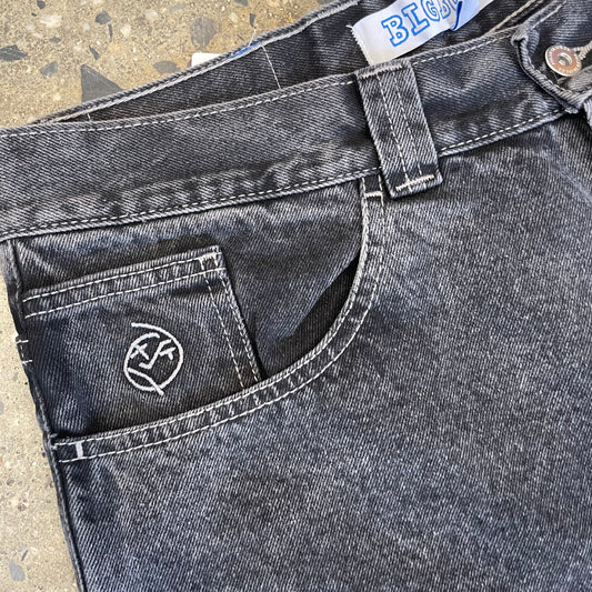 closeup of front pocket with white stitch logo and detail