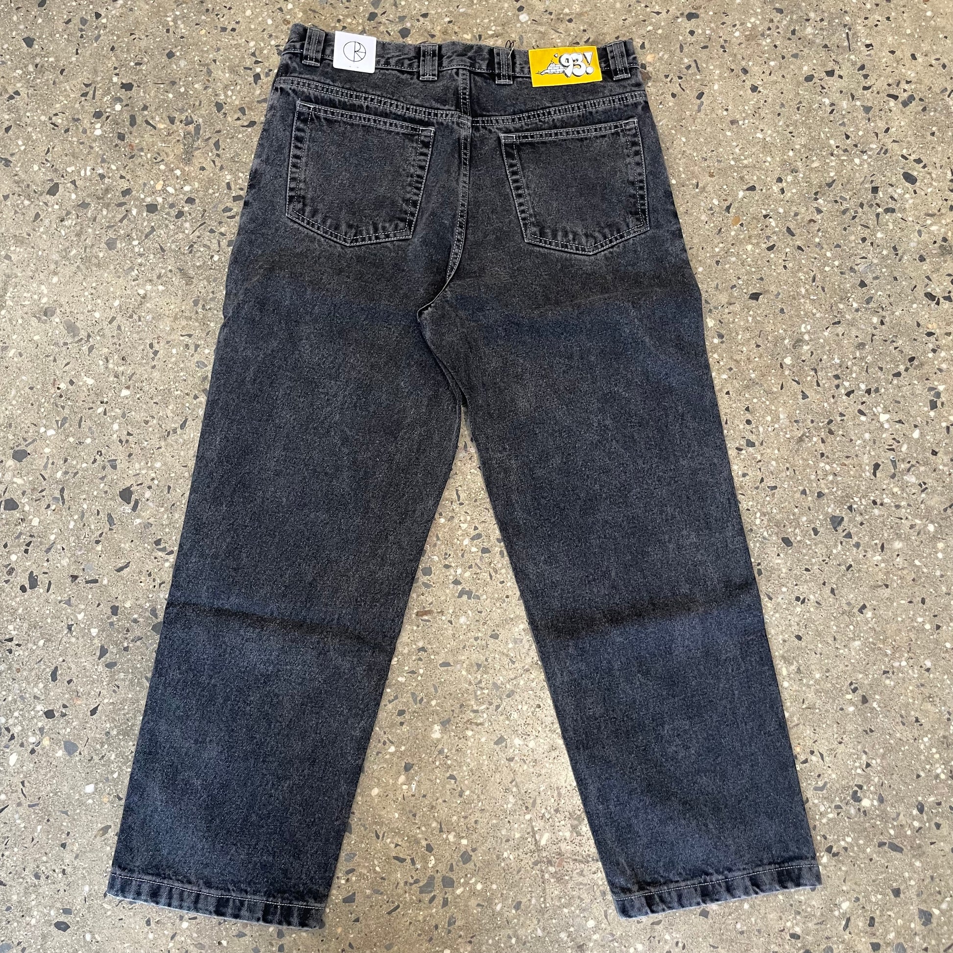 back view of silver black denim jeans