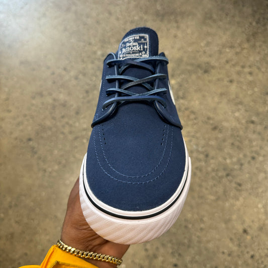 top down view of navy and white low top skate sneaker