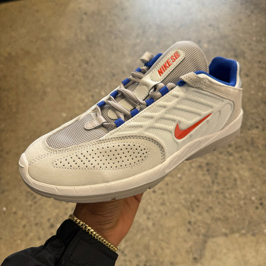white, orange, and blue suede and nylon sneaker with grey sole