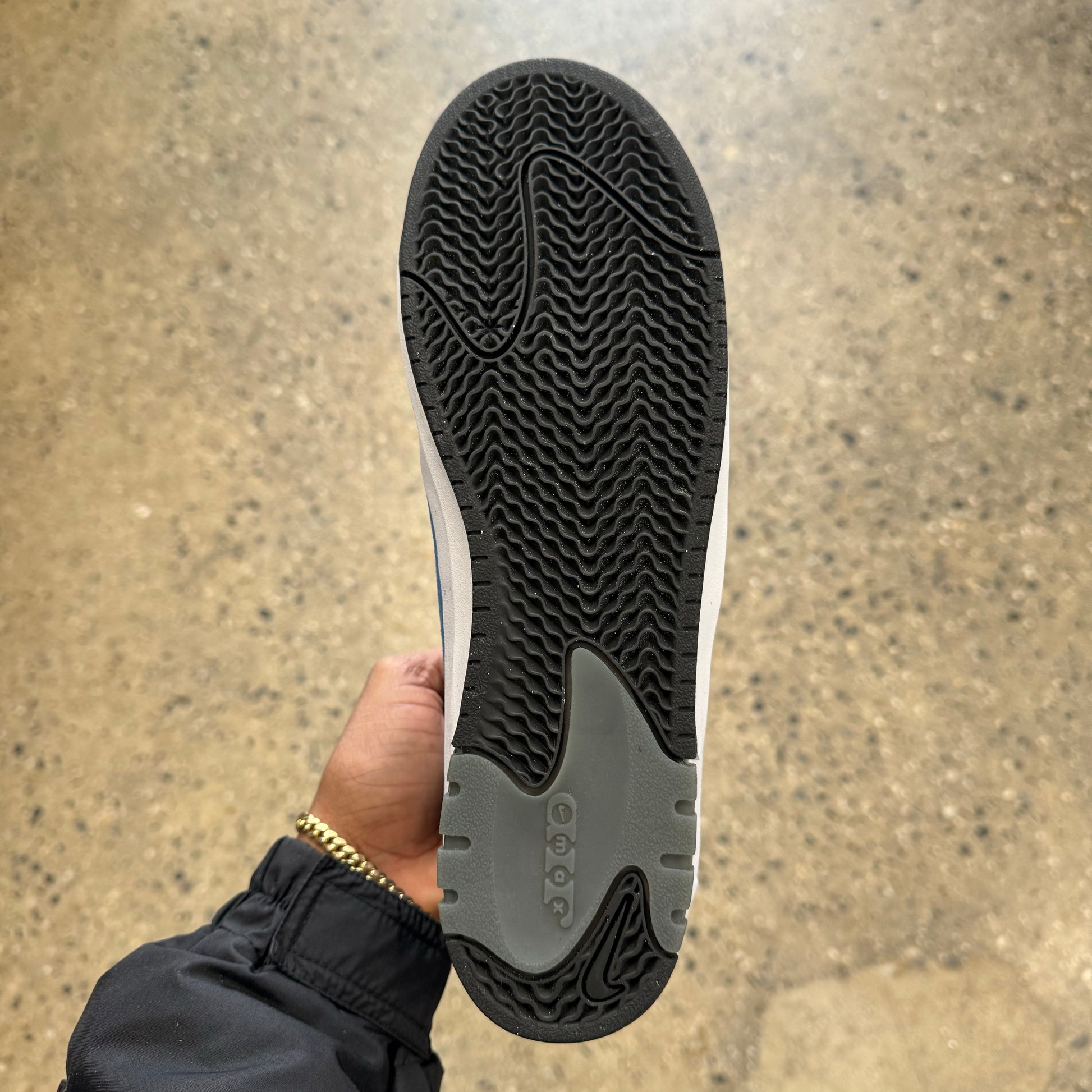 view of bottom of skate shoe, black sole