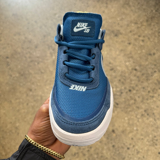 top down view of blue suede and mesh kids skate sneaker