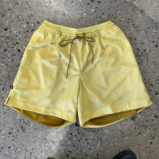inside of light gold reversible shorts