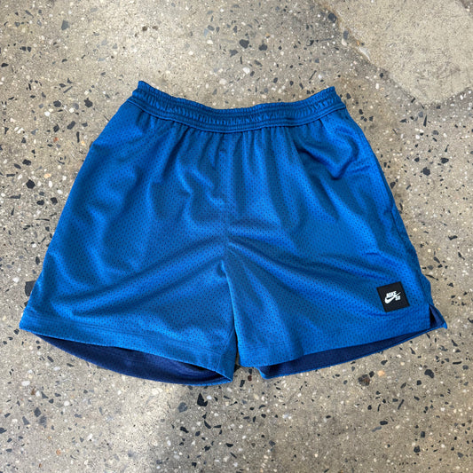 blue shorts with logo in corner