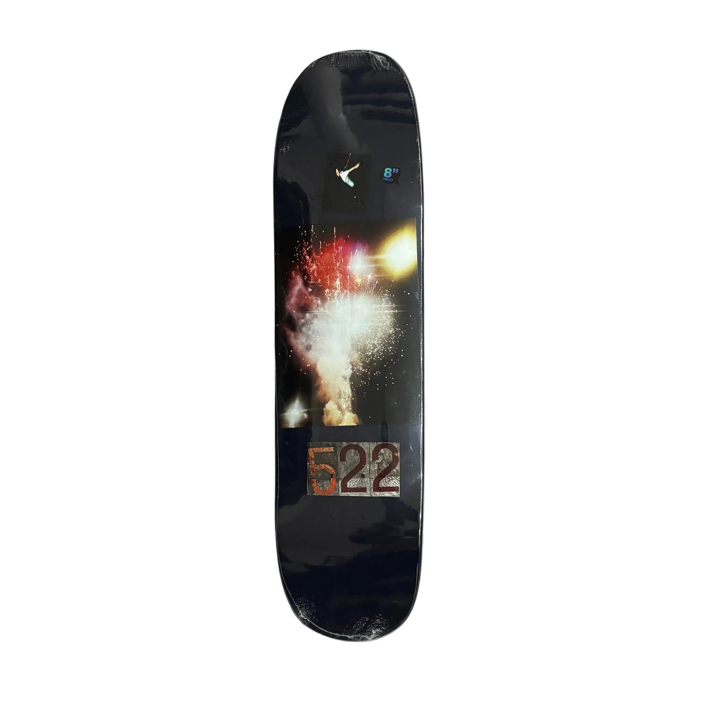Skateboard deck with a colorful design on a white surface