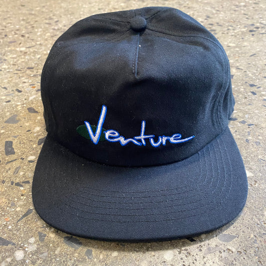 White and blue venture hand style logo embroidered on black five panel snapback cap, front view